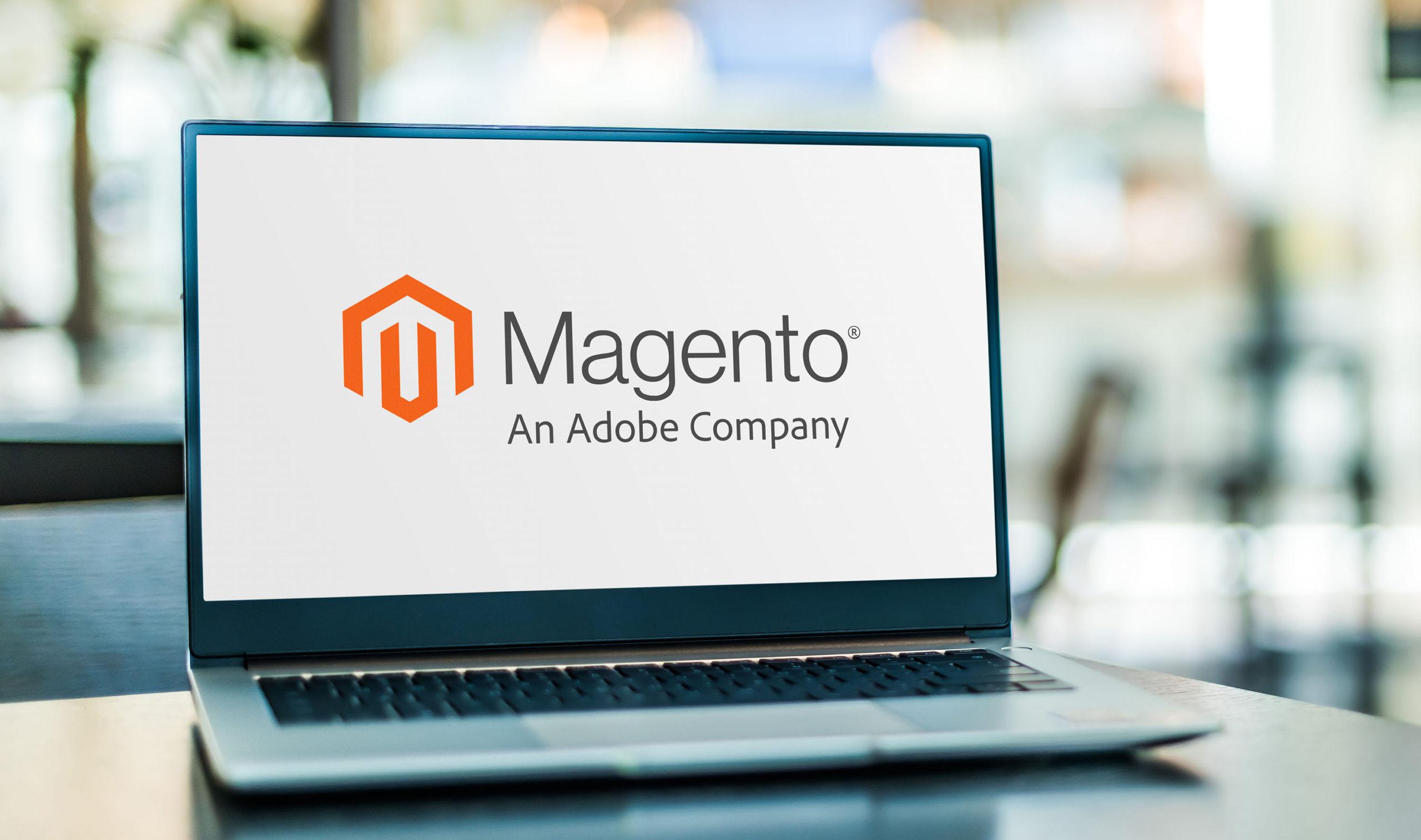 Laptop computer displaying logo of Magento